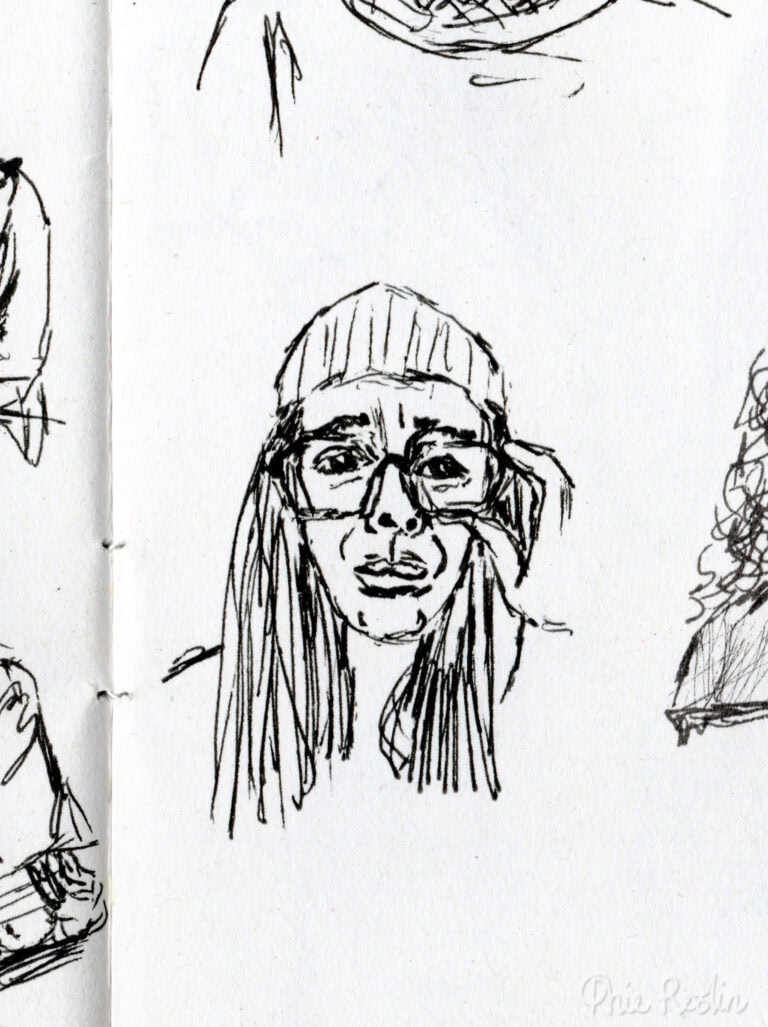 Pen sketch self portrait of worried looking face wearing glasses and holding them in left hand.